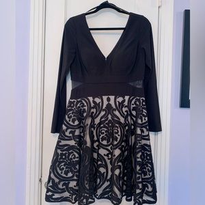 Short, black, formal dress.